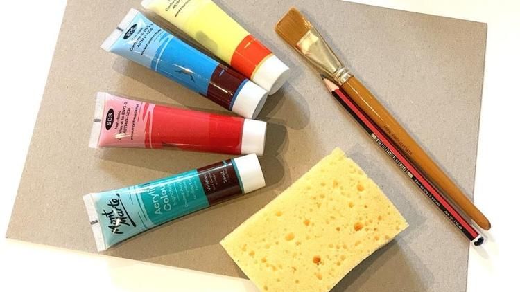 A sponge, paints and a paintbrush.